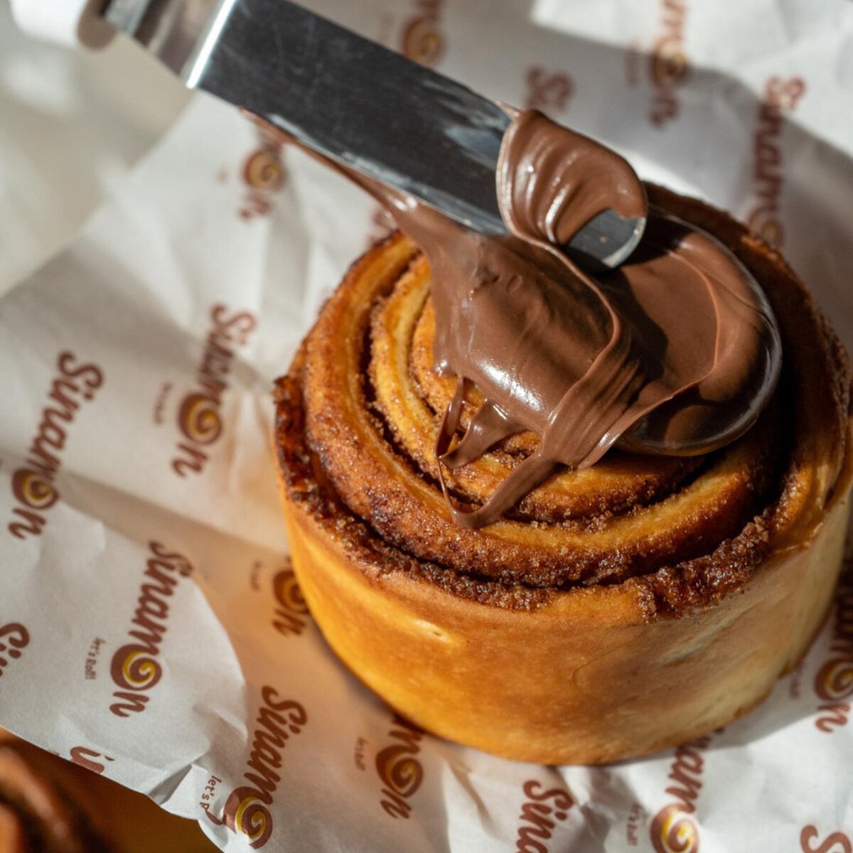 Sinamon Jakarta storefront with customers