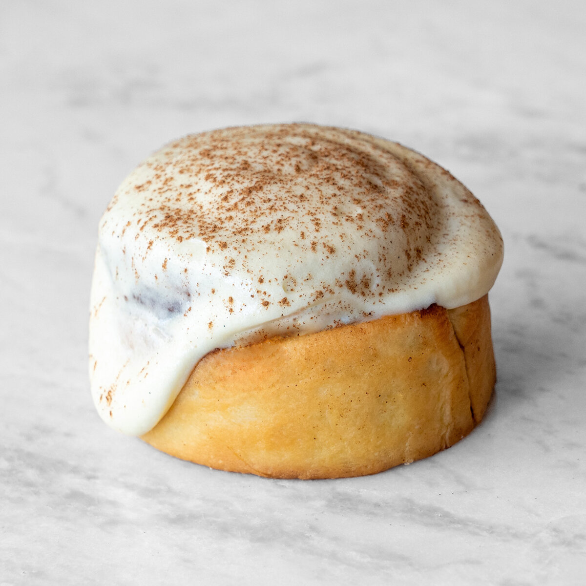 Cream Cheezin' Roll with extra cream cheese icing